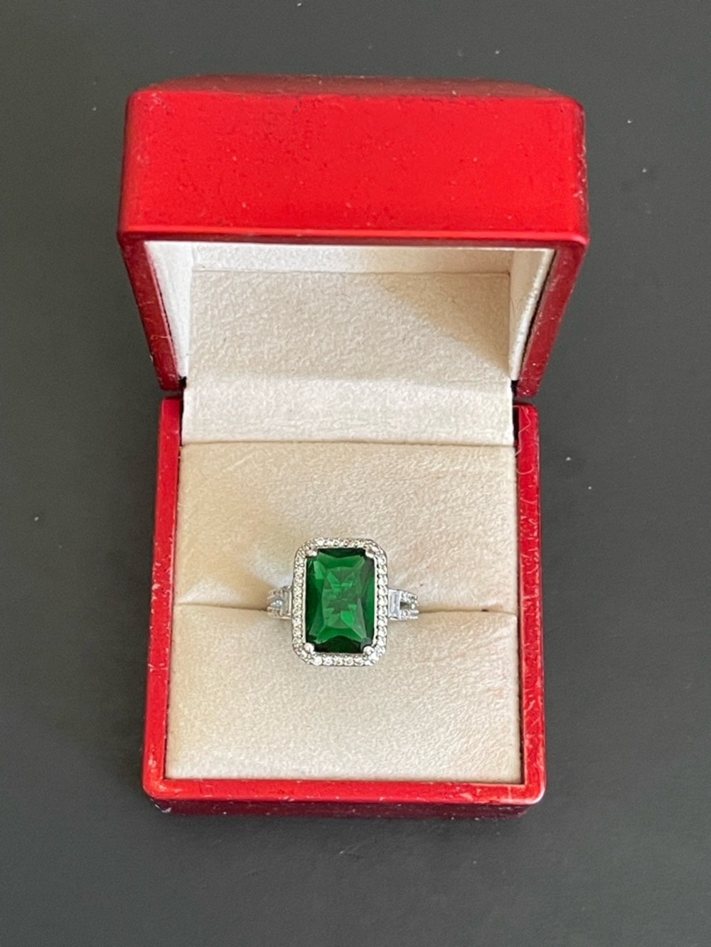 Elegant Green Emerald-Cut Halo Ring.